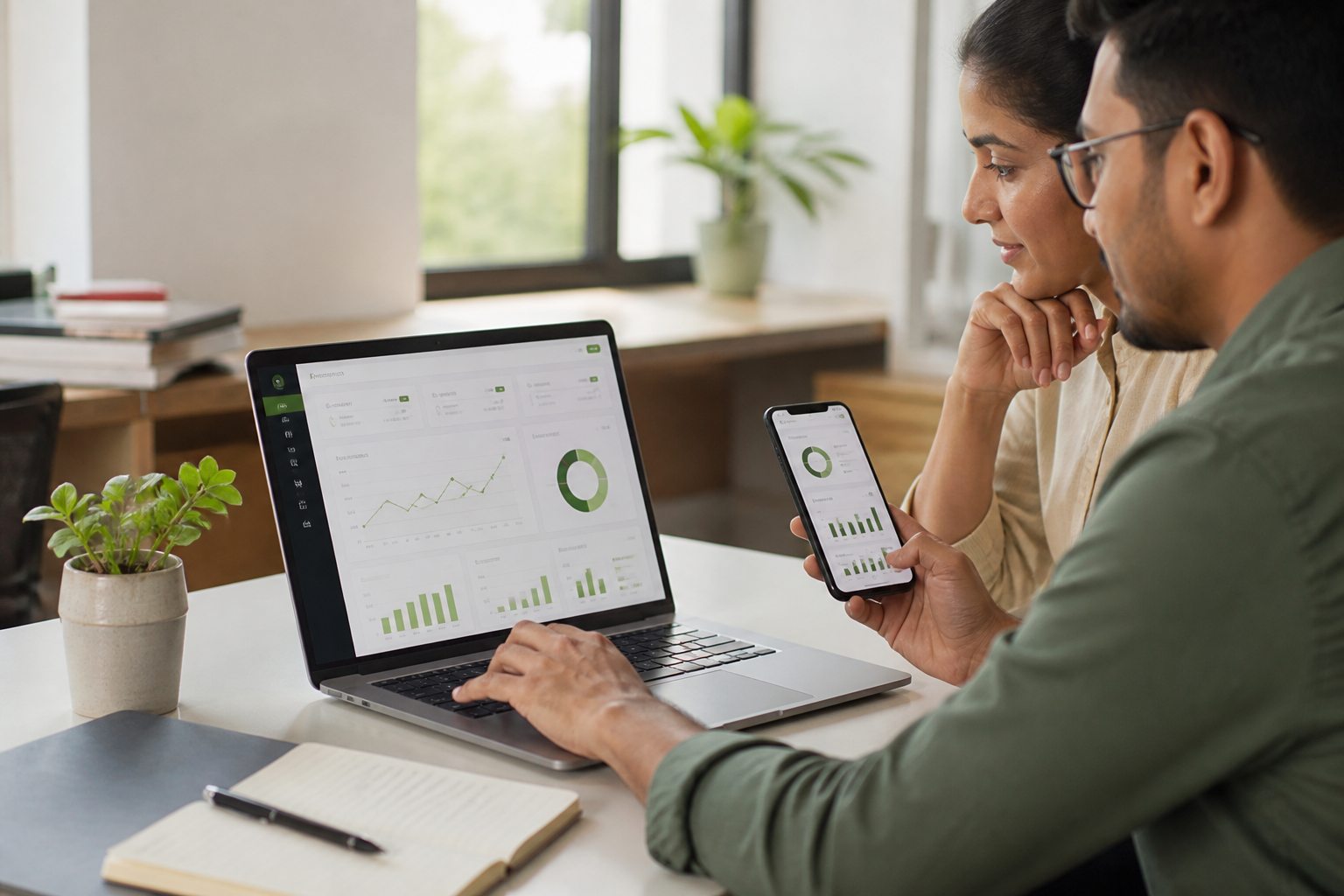 Business owners reviewing a web dashboard and mobile application